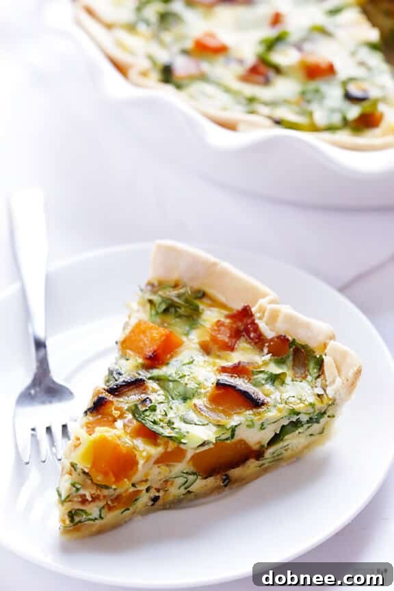 Full Butternut Squash, Arugula, and Bacon Quiche, ready to be sliced