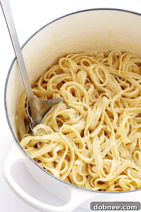 Delicious and creamy skinny fettuccine alfredo served in a bowl, lightened up for a healthier meal.