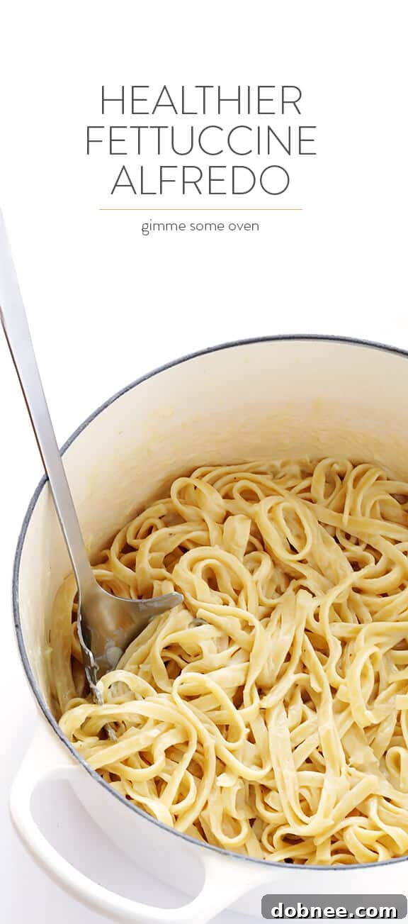 Full spread of skinny fettuccine alfredo with side salad, demonstrating a complete meal.