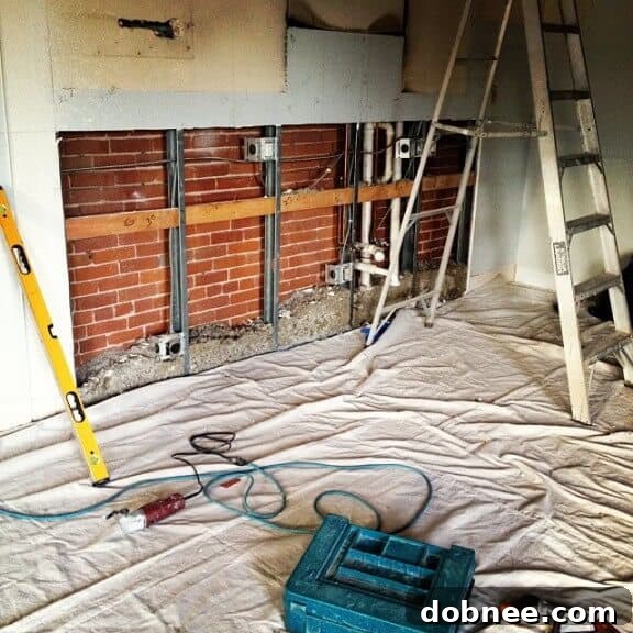 Newly installed kitchen flooring from Lowe's, light gray tile.