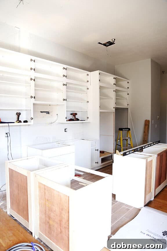 Installed kitchen cabinets awaiting appliances.