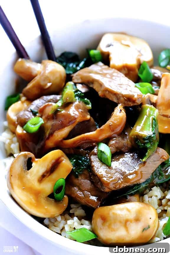 Perfectly cooked ginger beef strips mingled with tender mushrooms and vibrant kale, all coated in a savory sauce – an ideal quick dinner.