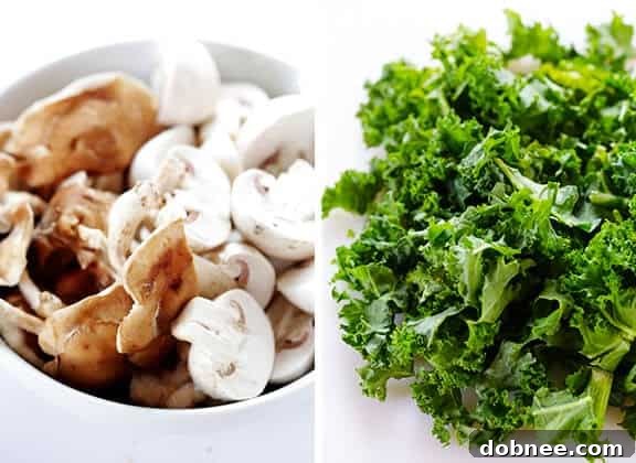 Assorted fresh vegetables including a mix of shiitake and button mushrooms, and freshly chopped kale, prepped for the stir-fry.