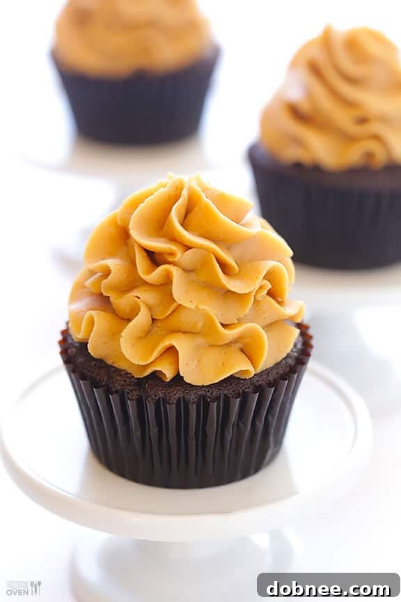 A cross-section of a Chocolate Peanut Butter Cupcake revealing the Reese's
