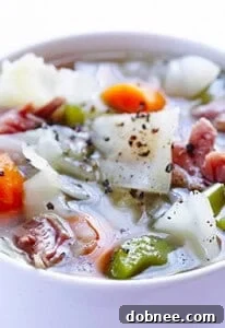 Hearty Ham and Cabbage Soup in a bowl, ready to be served