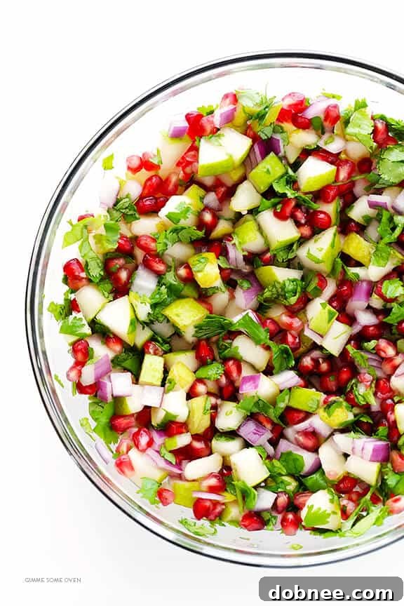 A serving of Pear Pomegranate Salsa with tortilla chips