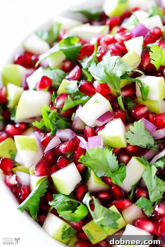 Bowl of 5-Ingredient Pear Pomegranate Salsa ready to serve