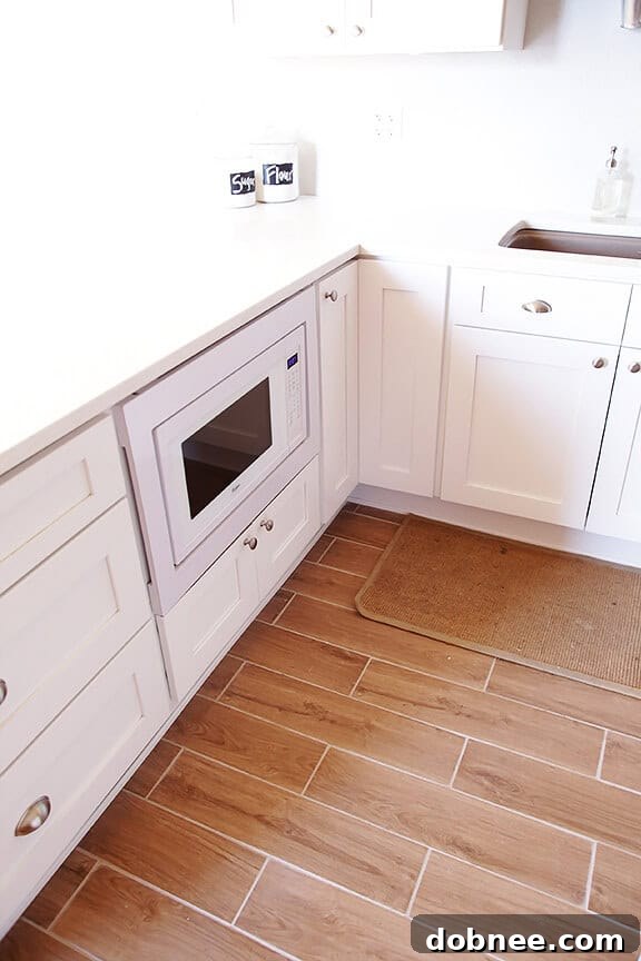 Wood-Grain Tile Flooring in White Kitchen