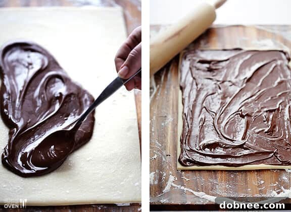 Spreading Nutella generously and evenly on cinnamon roll dough