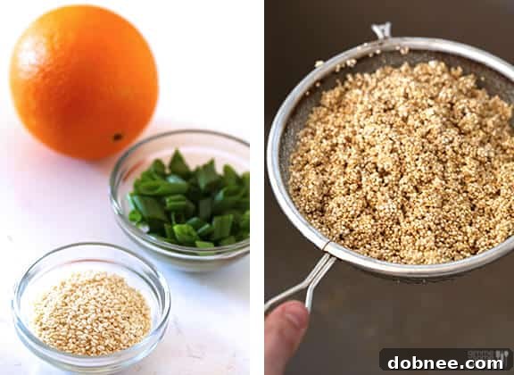 Finished Skinny Orange Chicken in a pan, garnished with fresh green onions and orange zest.