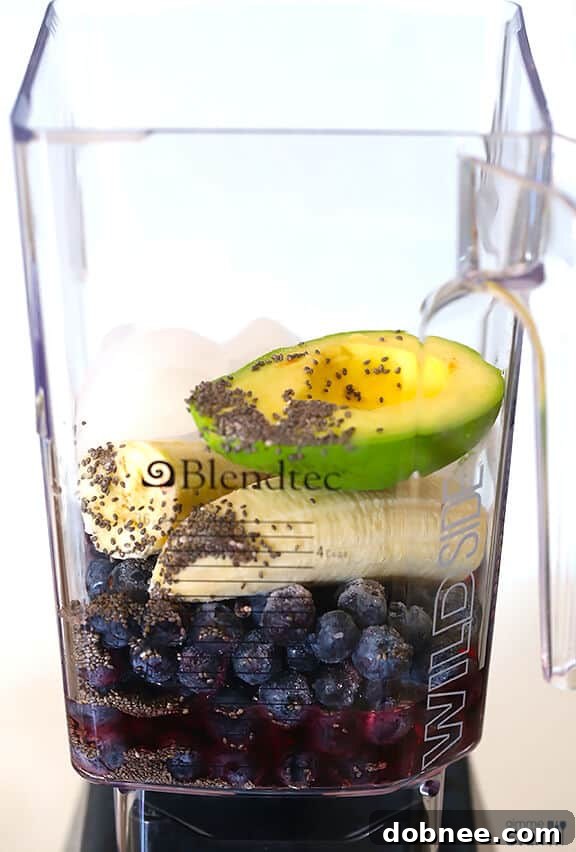 Adding all the healthy ingredients to a blender for the Brain Power Smoothie.