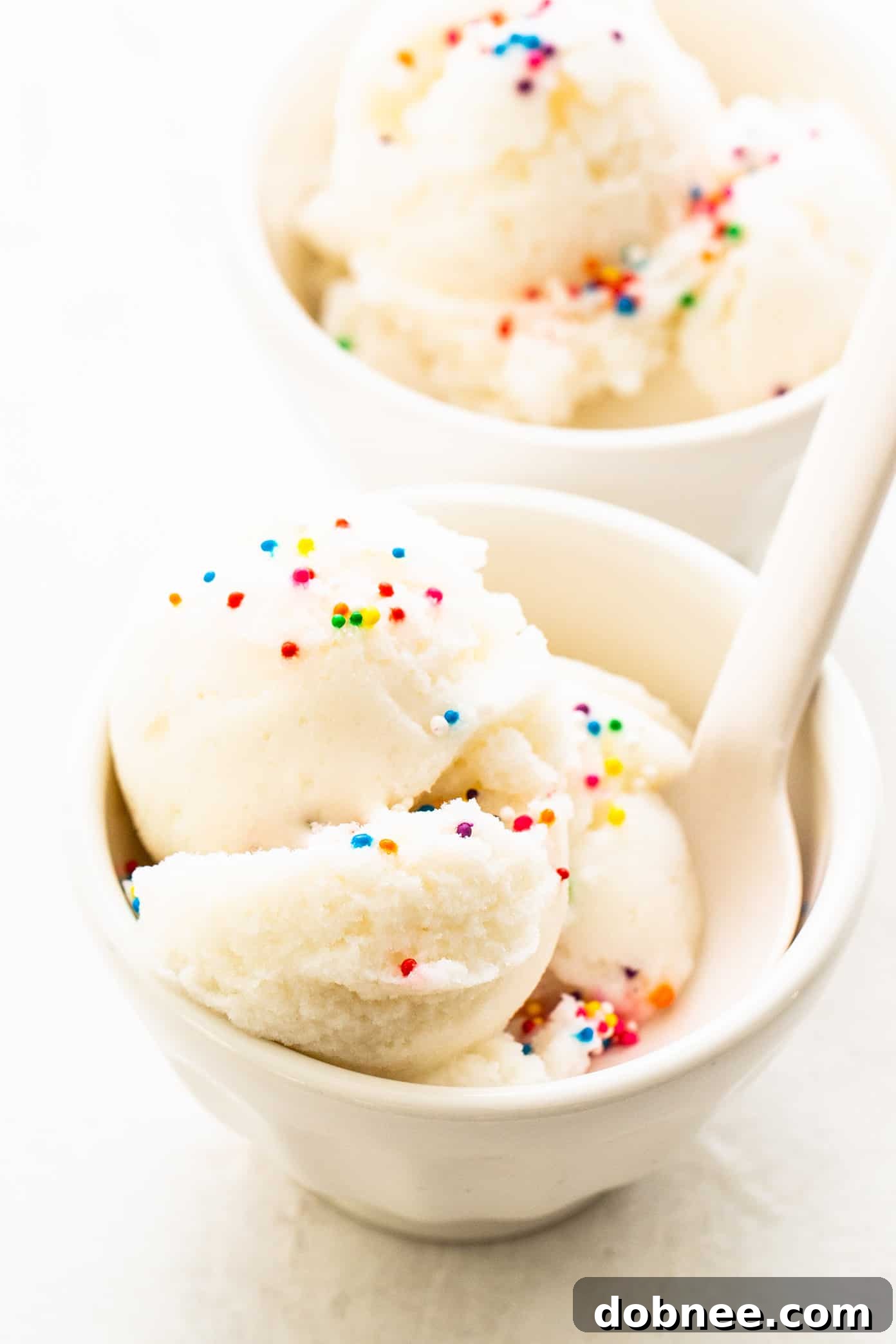 Delicious Snow Ice Cream in a bowl with a spoon, ready to be enjoyed.