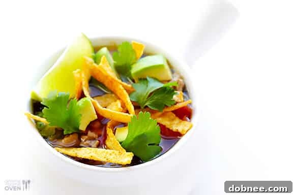 Another angle of Skinny Slow Cooker Taco Soup with fresh cilantro and lime