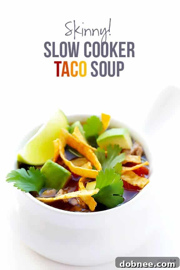A beautifully set table with a bowl of Skinny Slow Cooker Taco Soup