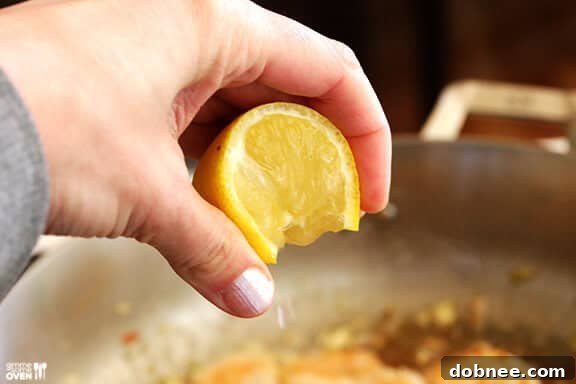Adding Chicken Stock and White Wine to Scampi