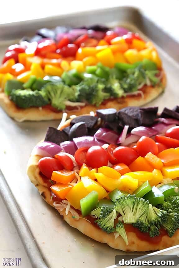 Close-up of Rainbow Veggie Flatbread Pizza slices ready to serve