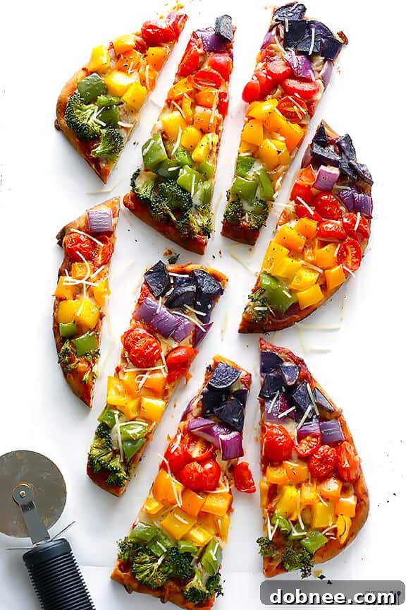 Close-up of freshly baked Rainbow Veggie Flatbread Pizza with colorful vegetables