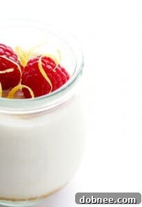 Lighter No-Bake Cheesecake with a sprinkle of lemon zest and fresh berries