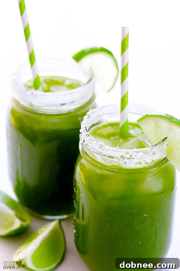 Refreshing Green Margarita Served Over Ice with Lime Garnish