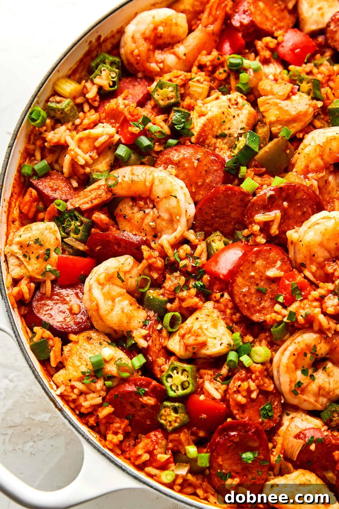 A vibrant and hearty pot of Jambalaya with chicken, shrimp, and sausage.