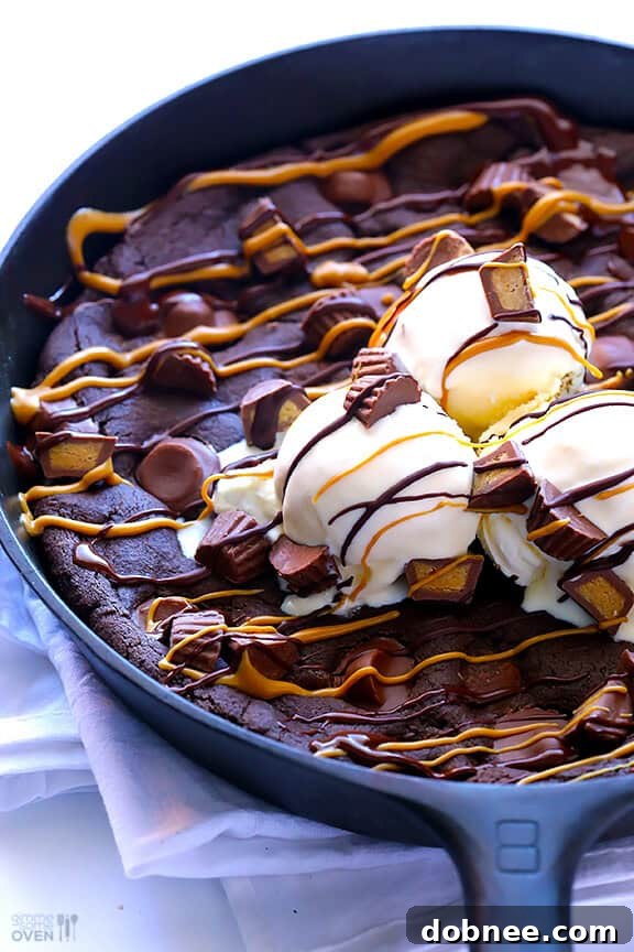 Decadent Chocolate Peanut Butter Skillet Cookie: A delightful blend of rich chocolate and creamy peanut butter baked in a skillet, perfect for sharing or a personal treat.