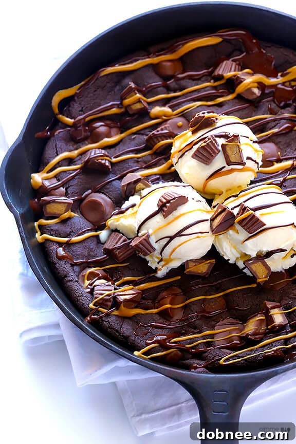 Freshly baked Chocolate Peanut Butter Skillet Cookie, ready for toppings and serving.