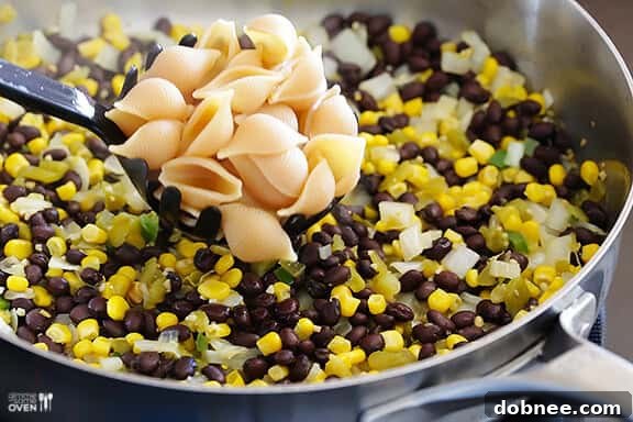 Pasta and sautéed vegetables for Mexican Mac and Cheese