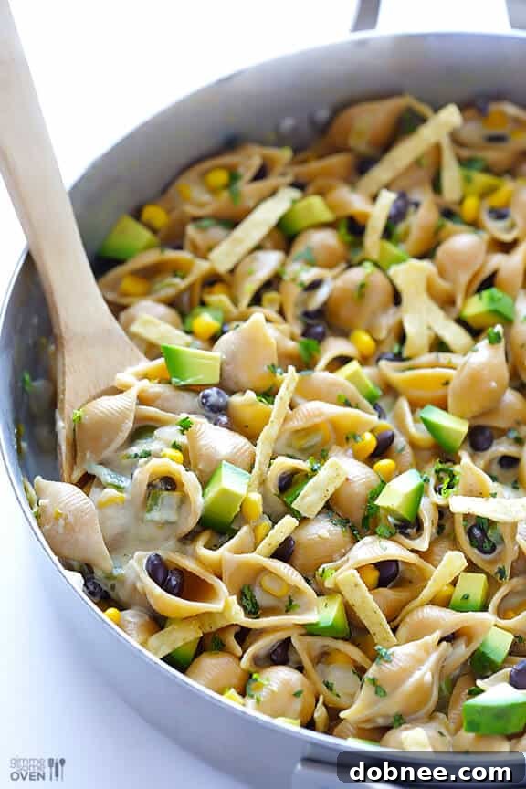 Served bowl of Mexican Mac and Cheese with toppings