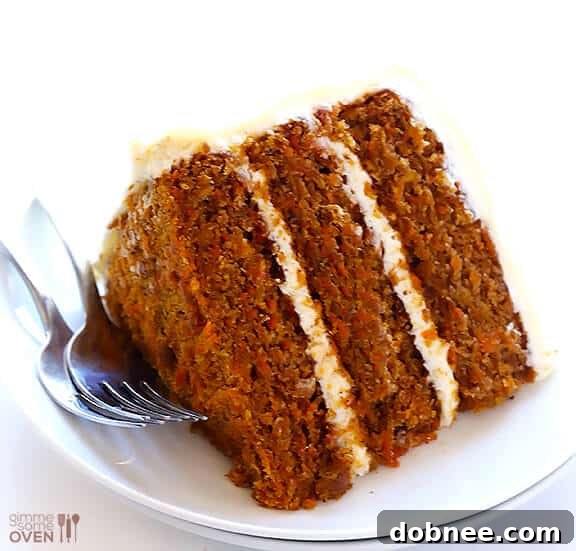A slice of moist Vegan Gluten-Free Carrot Cake, showcasing its delightful texture and rich color, ready to be enjoyed.
