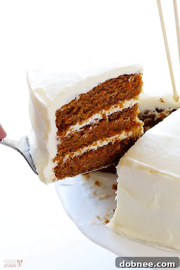 A beautifully presented slice of Vegan Gluten-Free Carrot Cake, ready to be served and enjoyed by guests.