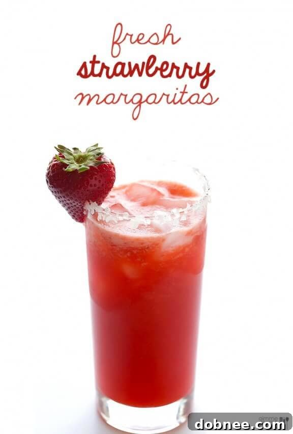 A beautifully garnished Fresh Strawberry Margarita, ready to be enjoyed on a festive occasion.
