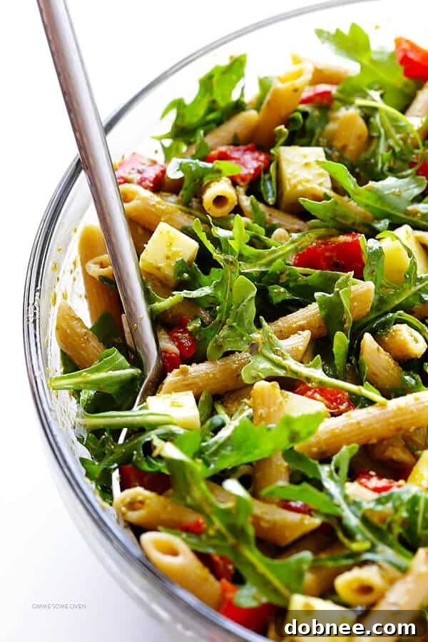 A close-up of the vibrant 5-Ingredient Pesto Pasta Salad, showcasing its fresh ingredients and rich flavors. | dobnee.com