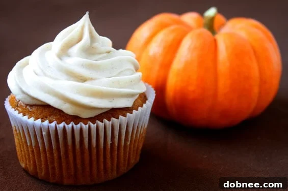 Seasonal Pumpkin Cupcakes with Cinnamon Cream Cheese Frosting, perfect for fall baking.