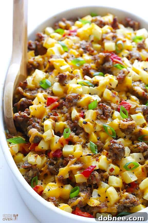 Slice of Easy Cheesy Breakfast Casserole on a plate with toppings