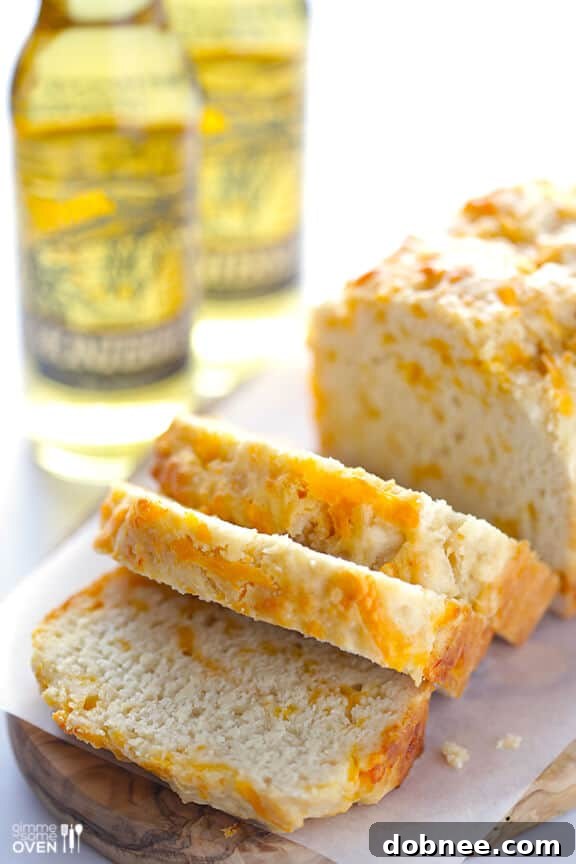 Delicious Garlic Cheddar Beer Bread baked to golden perfection, ready to slice and serve.