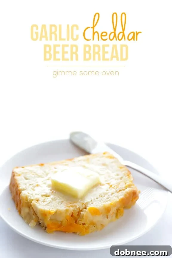 Final presentation of Garlic Cheddar Beer Bread on a cutting board, ready for enjoyment.