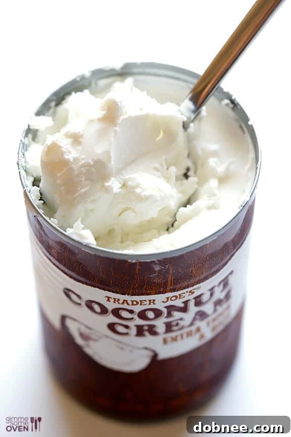 Close-up of fluffy coconut whipped cream with a spoon