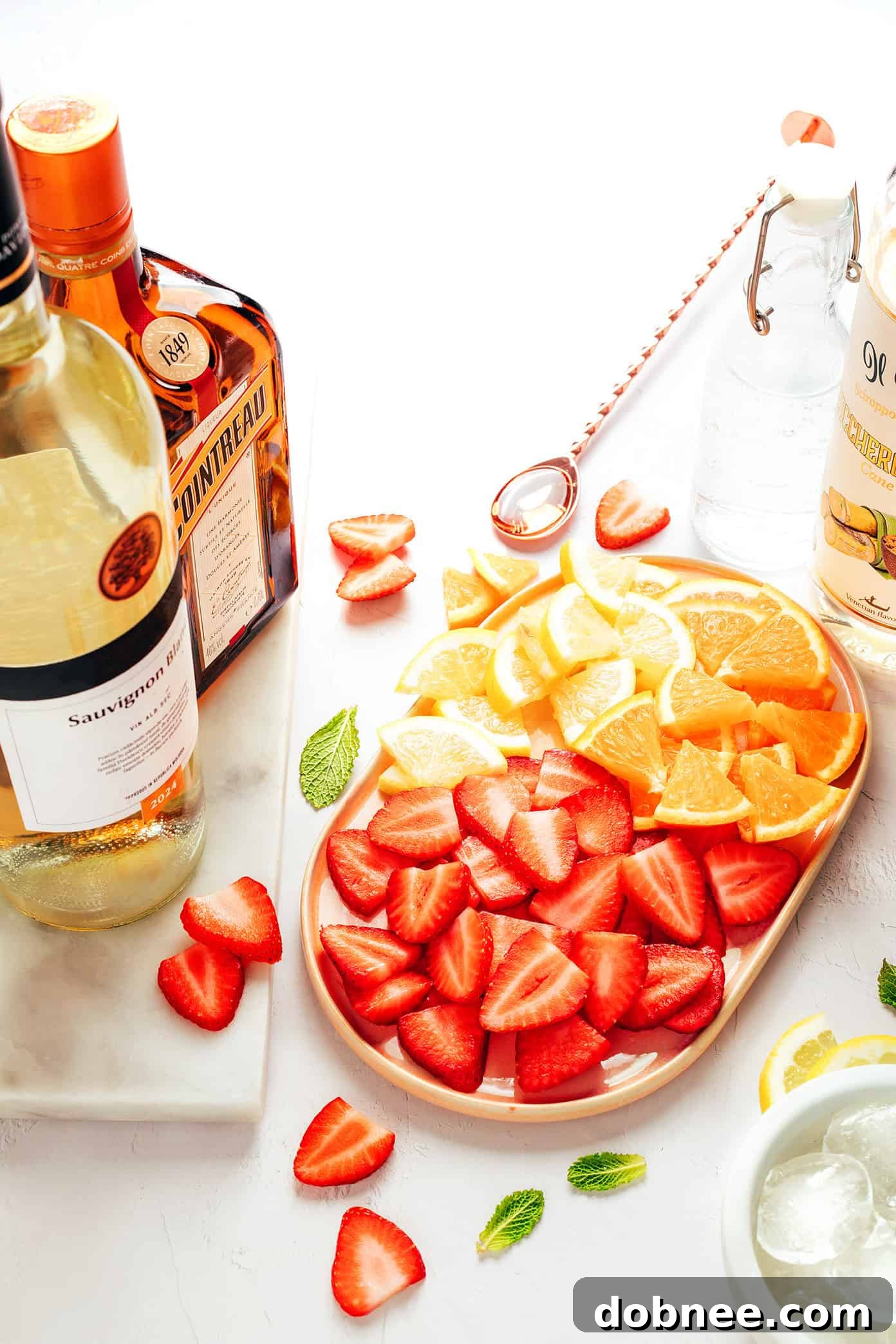 strawberry sangria ingredients on a wooden board