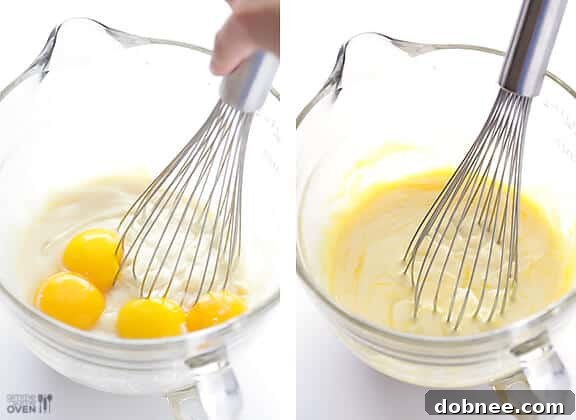 Creating the creamy base for the Mojito Pie filling. Whisking sweetened condensed milk and egg yolks for the pie custard.