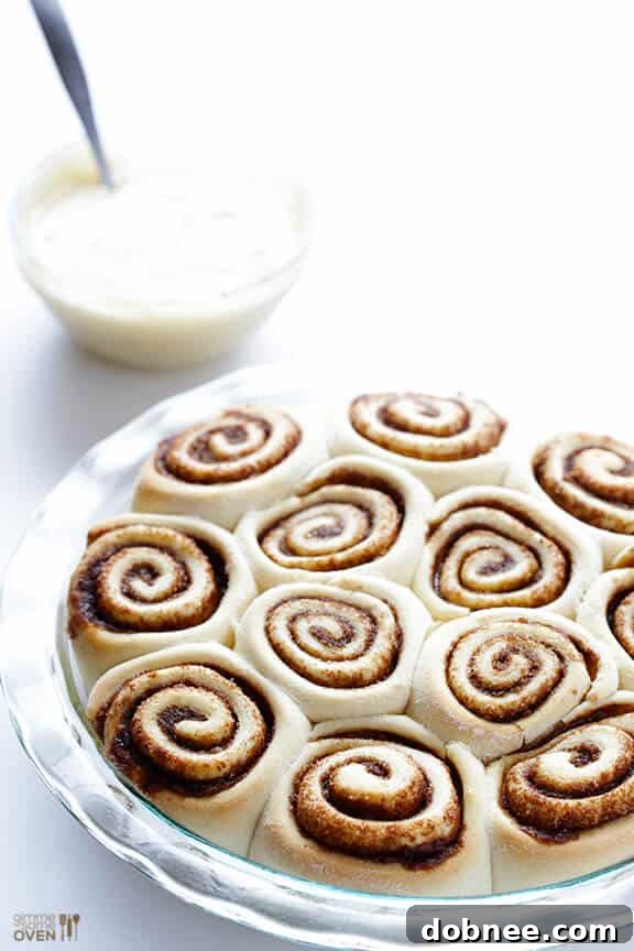 Golden brown butter cinnamon rolls fresh out of the oven, ready for frosting.