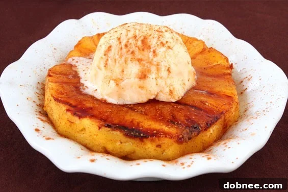 Original photo of Flameless Pineapple Foster, circa 2010, showing grilled pineapple topped with ice cream and a sprinkle of cinnamon.