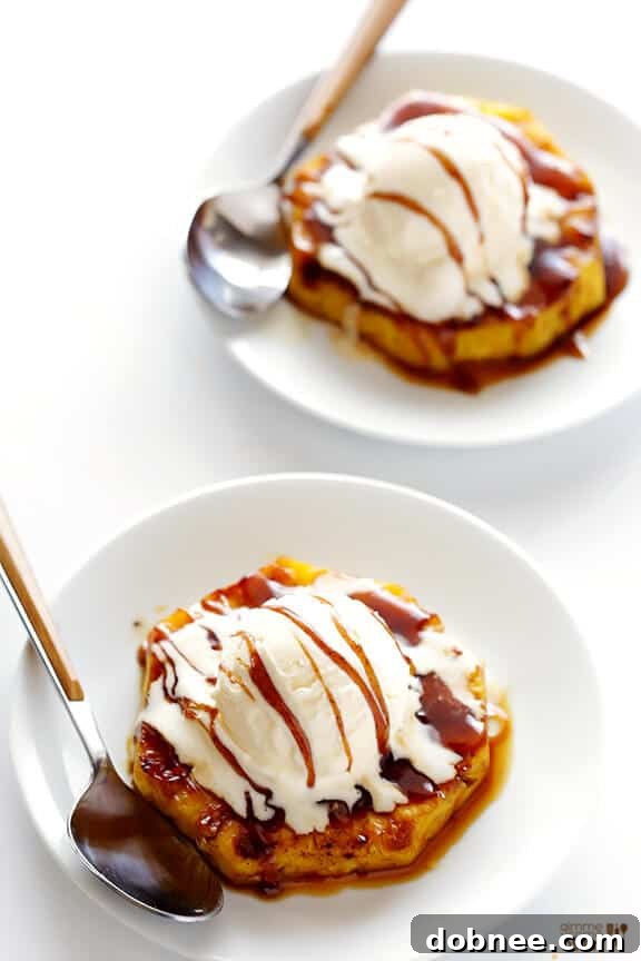 Grilled pineapple rings showcasing perfect golden grill marks, ready to be served.
