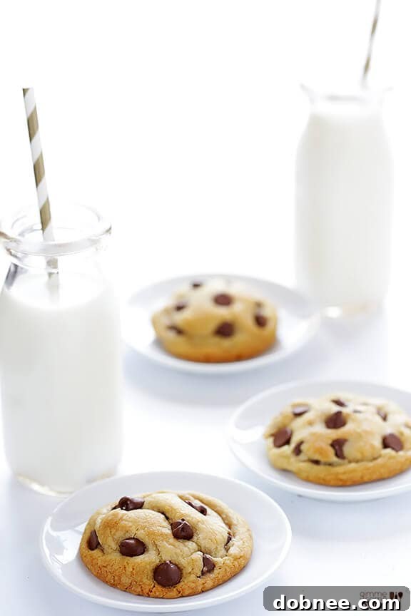 Close-up of a warm, gooey coconut oil chocolate chip cookie with melted chocolate chips