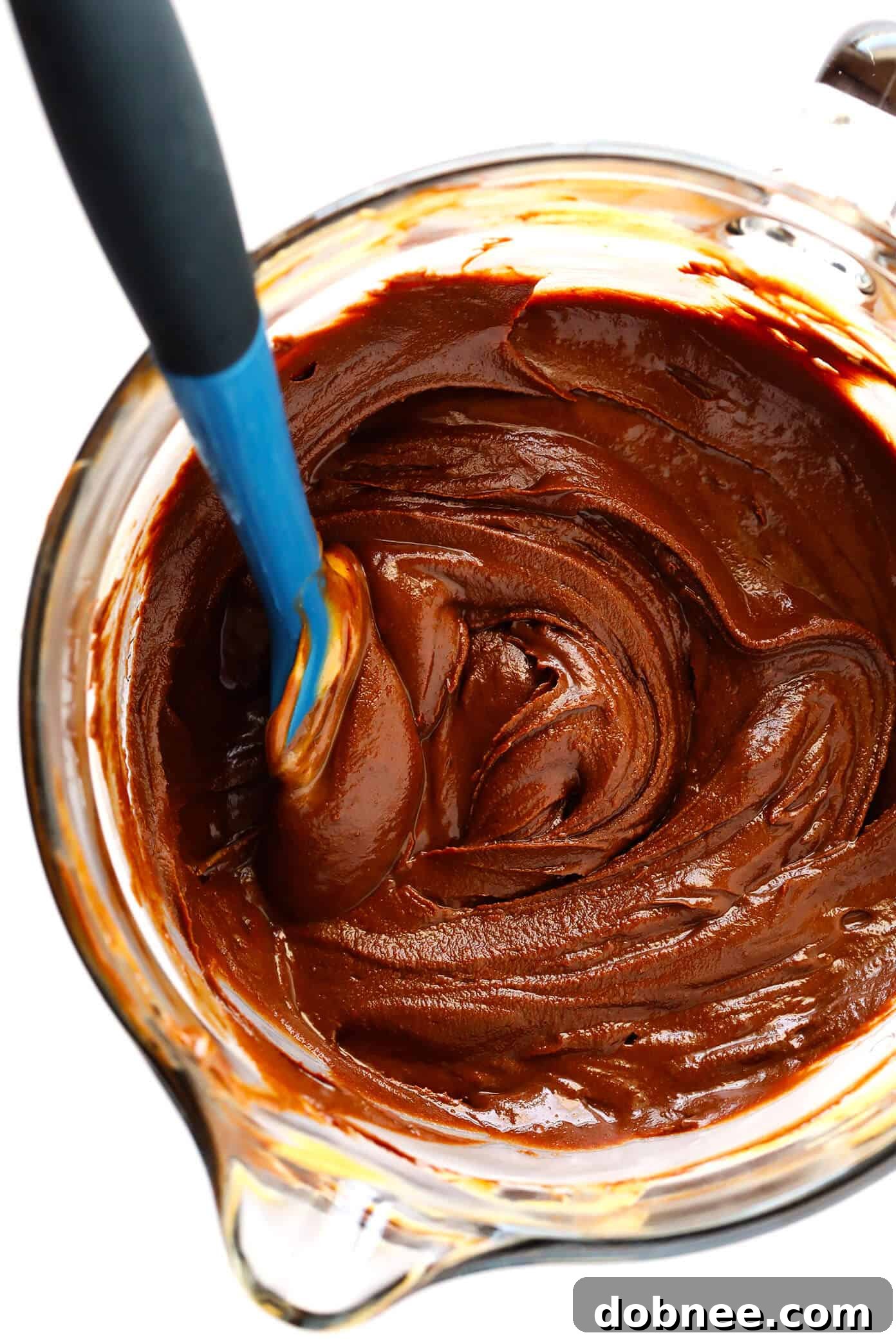 Smooth, glossy chocolate and peanut butter mixture after melting and stirring.
