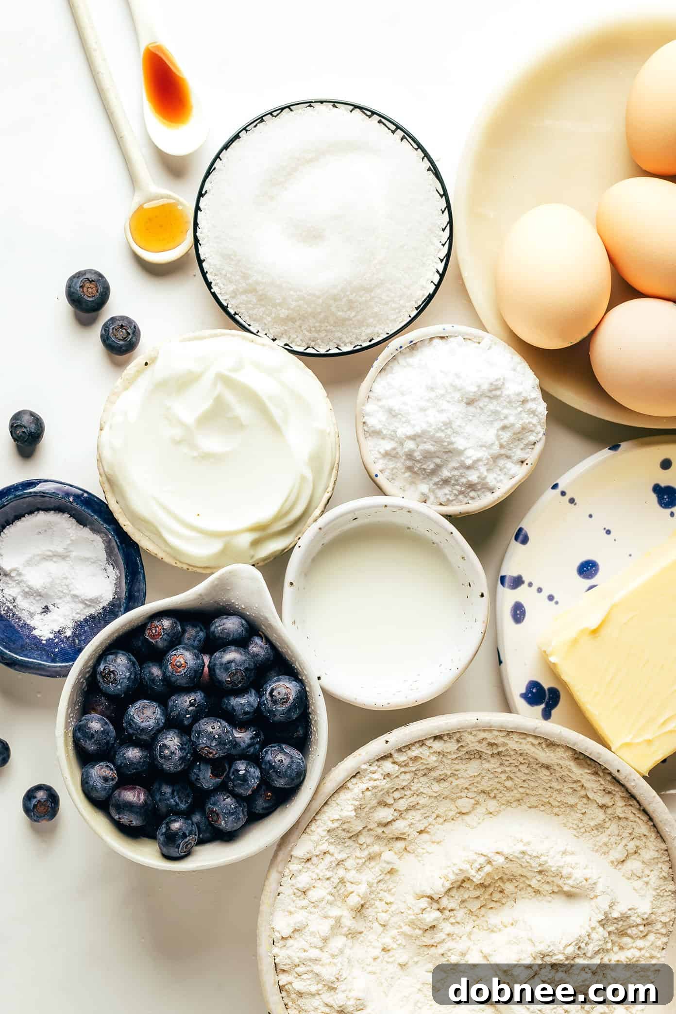 Close-up of a slice of blueberry bundt cake, showcasing its moist texture and abundant blueberries throughout the cake crumb.