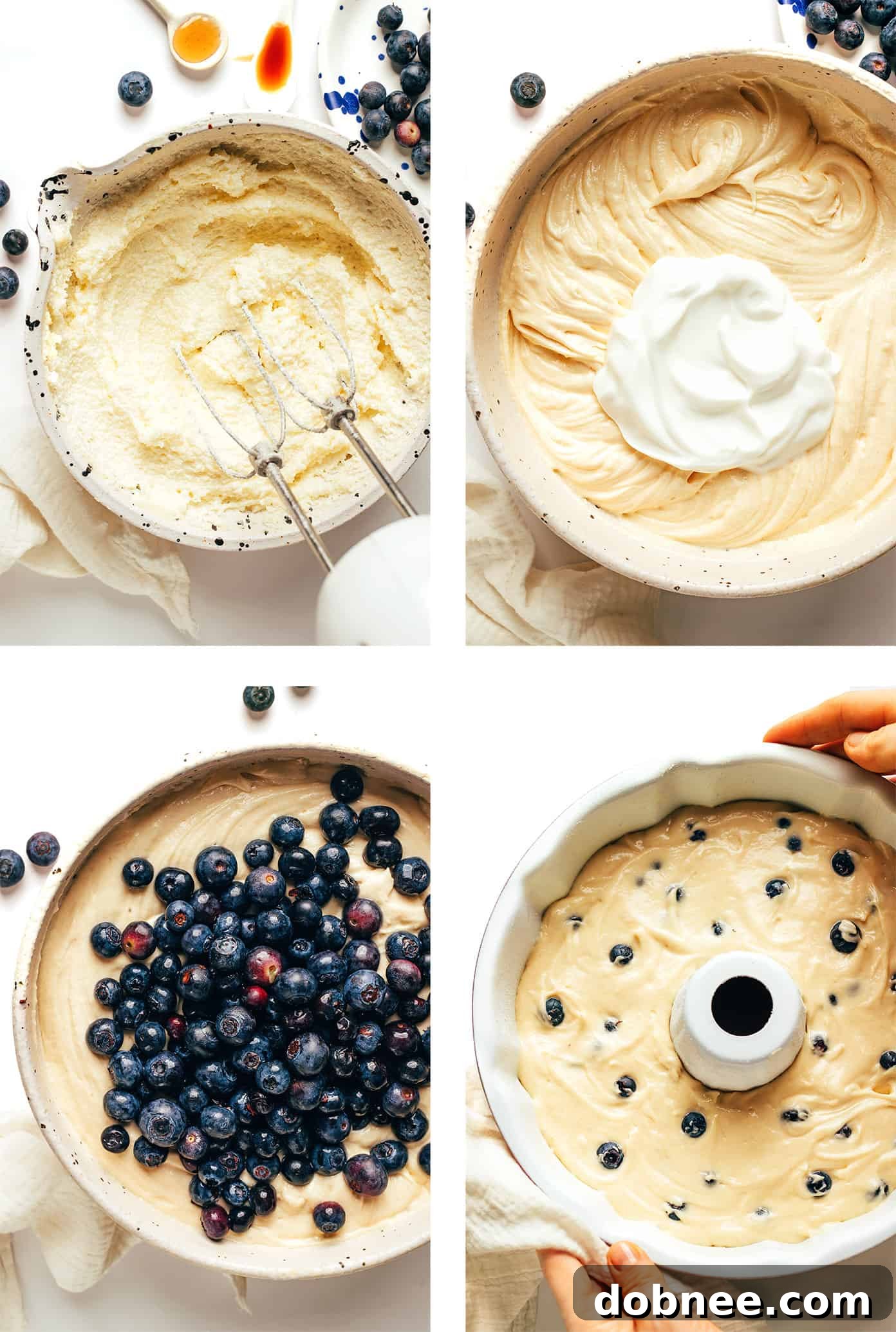 A close-up shot of raw blueberry cake batter being poured into a greased and floured bundt pan, showing the beautiful blue berries mixed in.