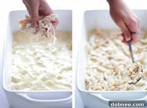 Layering tortillas and sauce in a baking dish