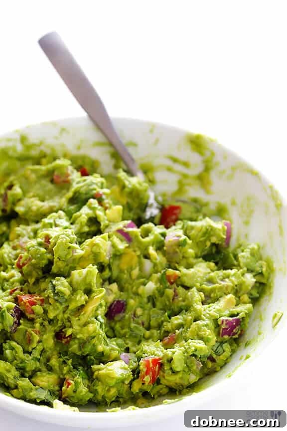 Mashing Italian Guacamole ingredients together