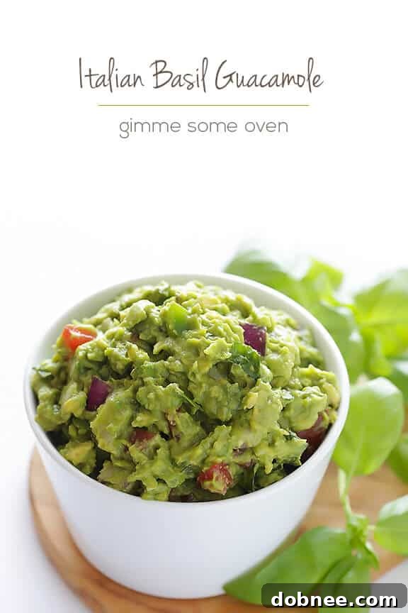 Serving bowl of Italian Guacamole with fresh basil