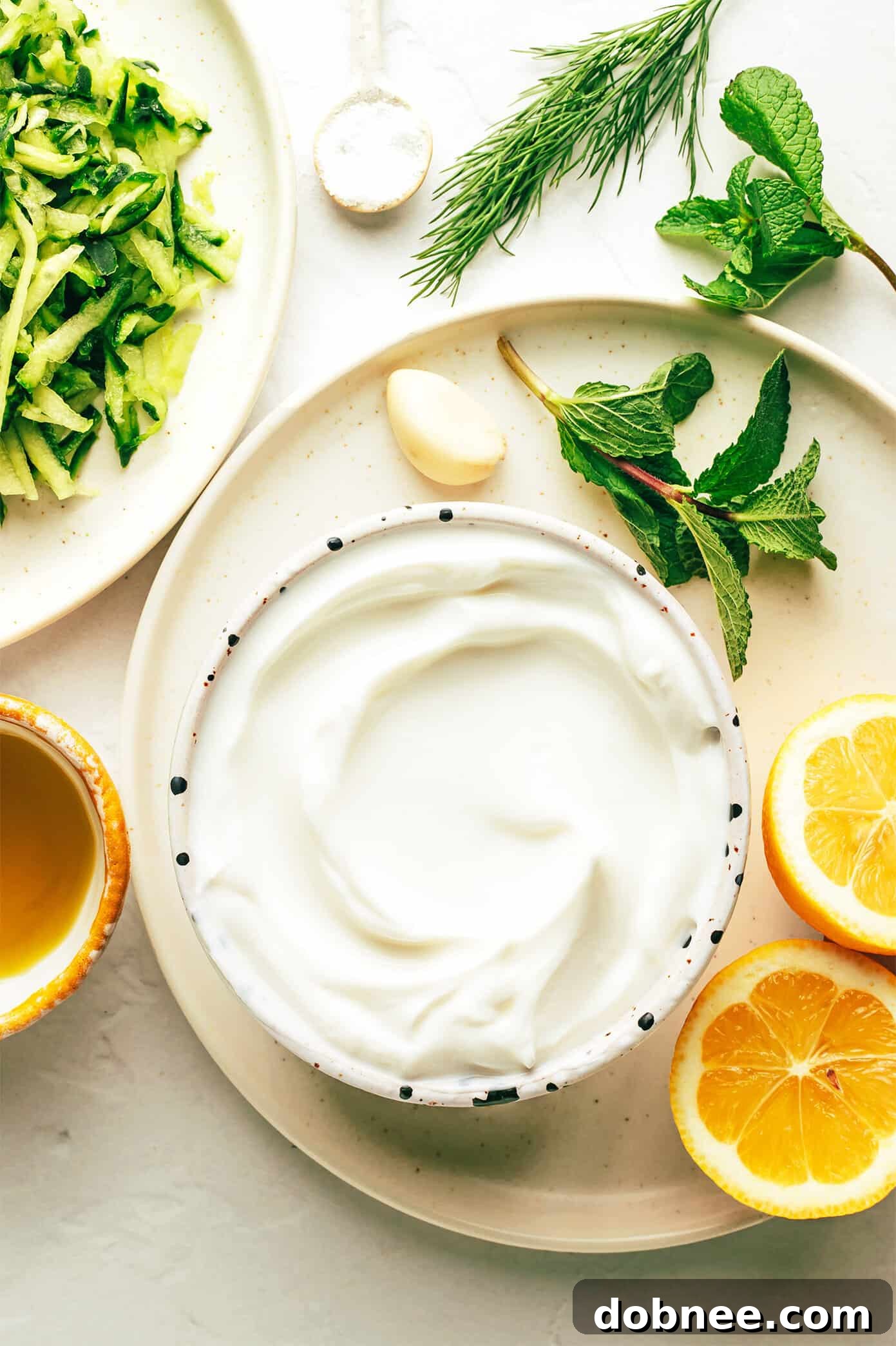 Refreshing Cucumber Yogurt Dip 3 A close-up of grated cucumber, the essential ingredient for adding crispness and freshness to Tzatziki, before being strained.